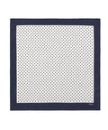 Navy blue square scarf with white polka dot pattern on a white background
