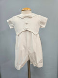 Baby boy outfit with decorative vest and bowtie.