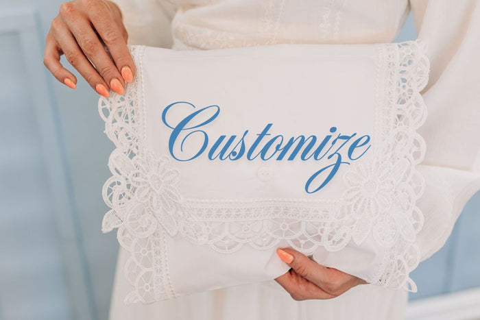 White lace edge envelope with custom embroidery.
