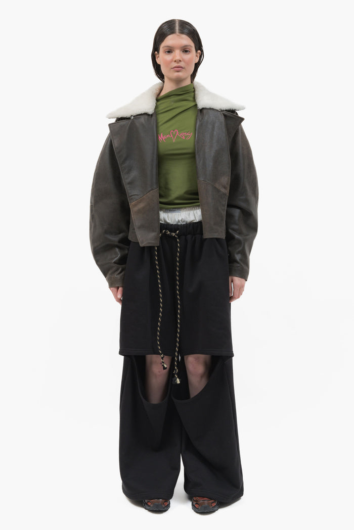 MANCANDY Wide Aviator Jacket in crackled black leather featuring a detachable shearling collar, oversized fit and curved sleeves.
