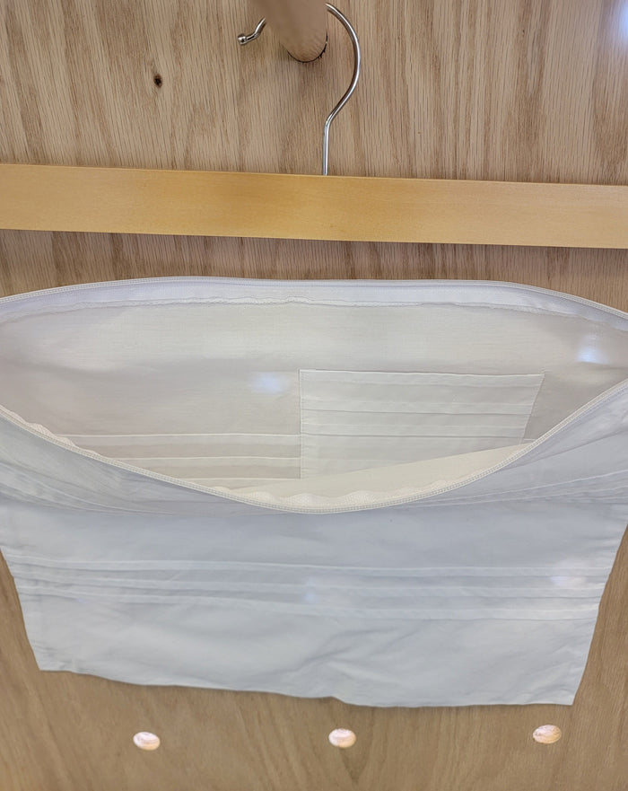 Open white envelope with pocket inside.
